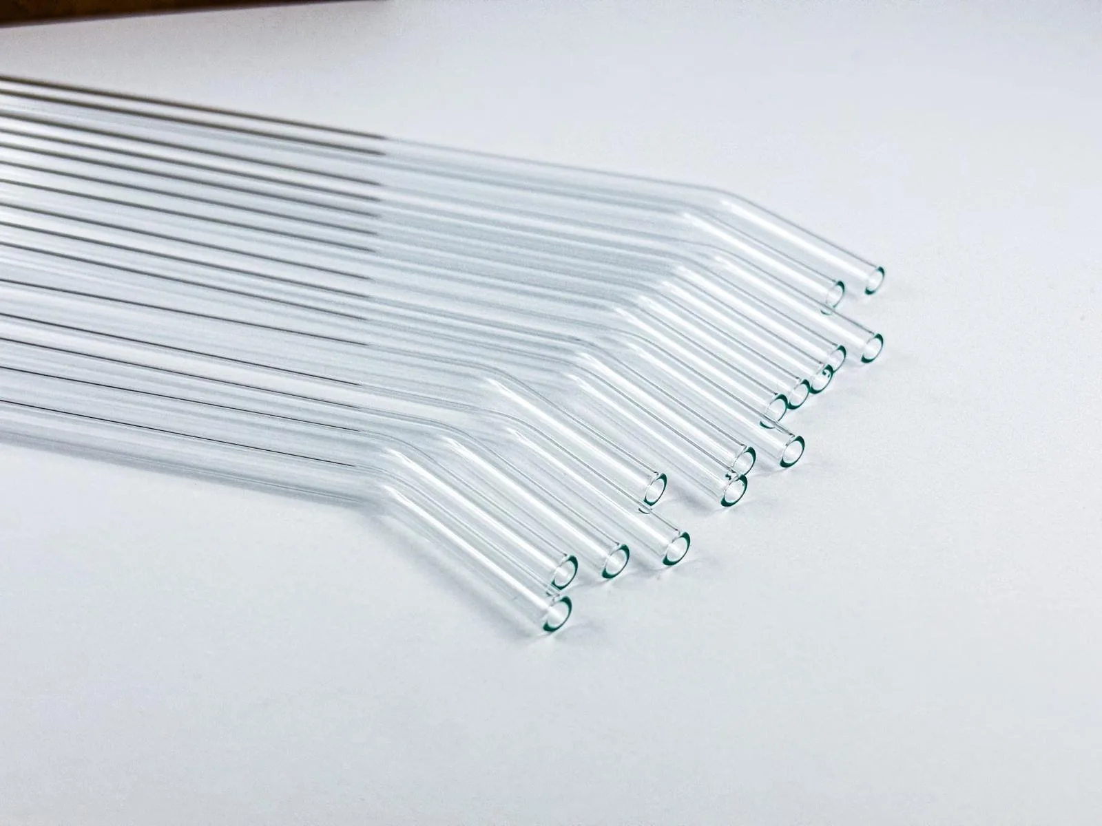 Close-up of clear bent BUXI glass straws